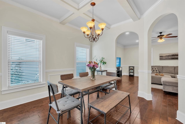 dining room with a healthy amount of sunlight, arched walkways, dark wood-style flooring, and beamed ceiling