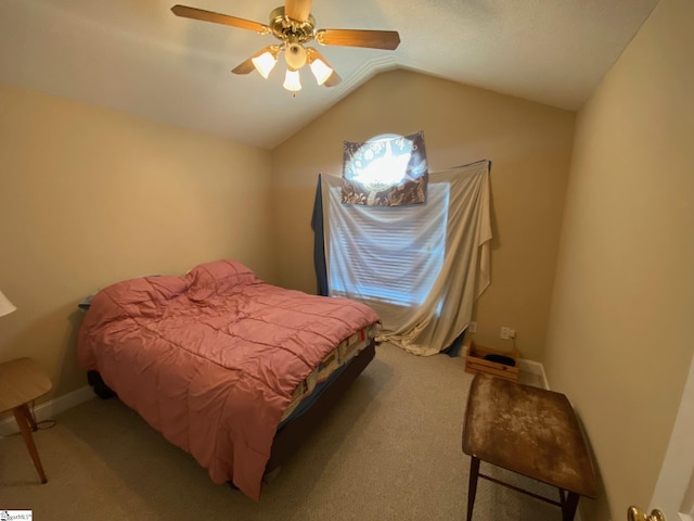 bedroom featuring lofted ceiling, carpet, baseboards, and ceiling fan