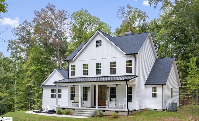 modern farmhouse style home with a porch, a shingled roof, crawl space, a standing seam roof, and a chimney