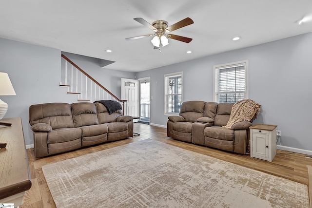 living area with baseboards, ceiling fan, light wood finished floors, and recessed lighting