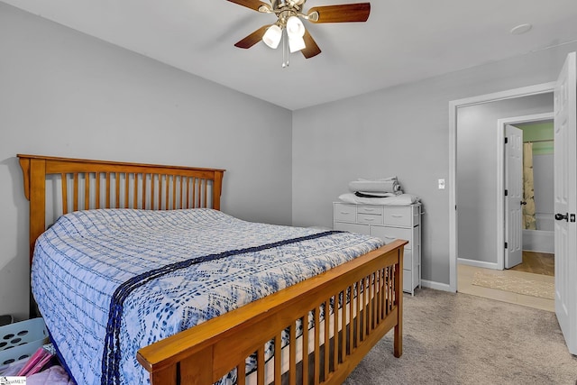 bedroom with light carpet, ceiling fan, and baseboards