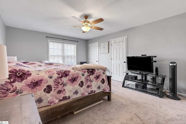 carpeted bedroom featuring ceiling fan