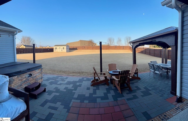 view of patio featuring outdoor dining area and a fenced backyard