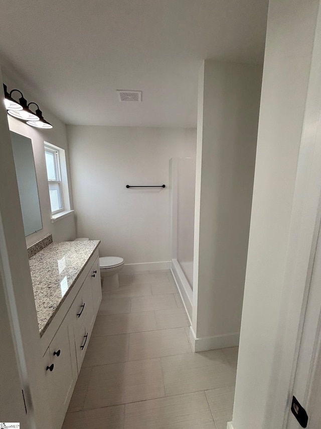 full bathroom with a stall shower, baseboards, visible vents, toilet, and vanity