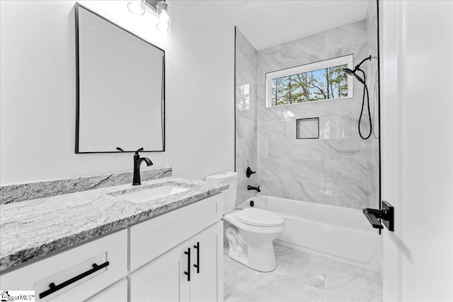 bathroom with toilet, marble finish floor, vanity, and shower / bathing tub combination