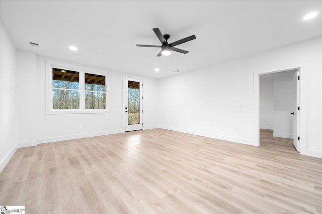 empty room featuring light wood-style flooring, baseboards, a ceiling fan, and recessed lighting