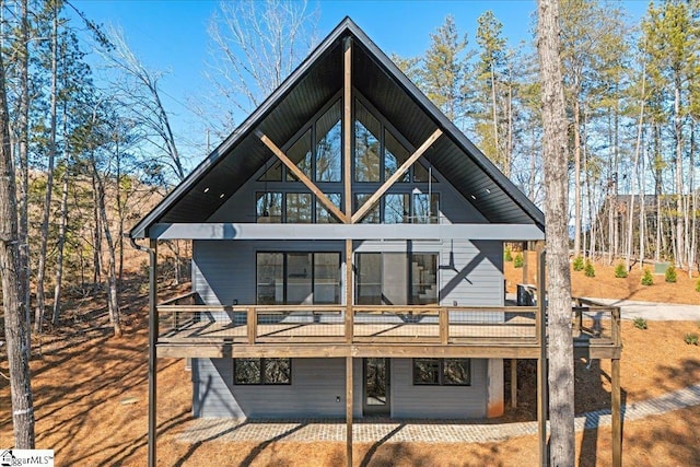 back of house with a wooden deck