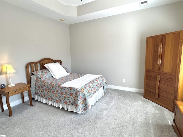 bedroom featuring light carpet, baseboards, and visible vents