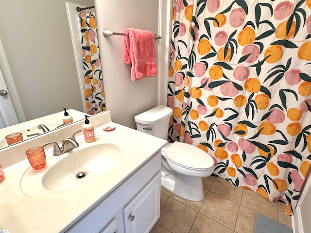 bathroom with toilet, vanity, a shower with shower curtain, and tile patterned floors