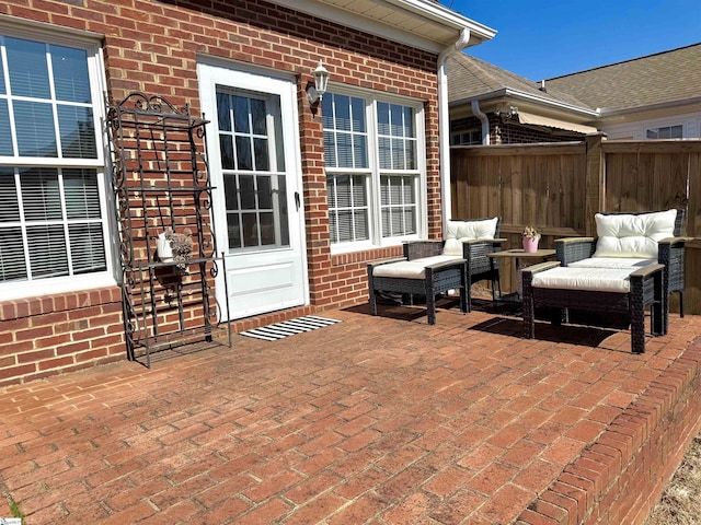 view of patio / terrace featuring fence