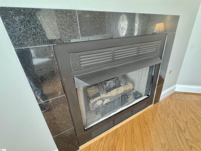 interior details with wood finished floors and baseboards