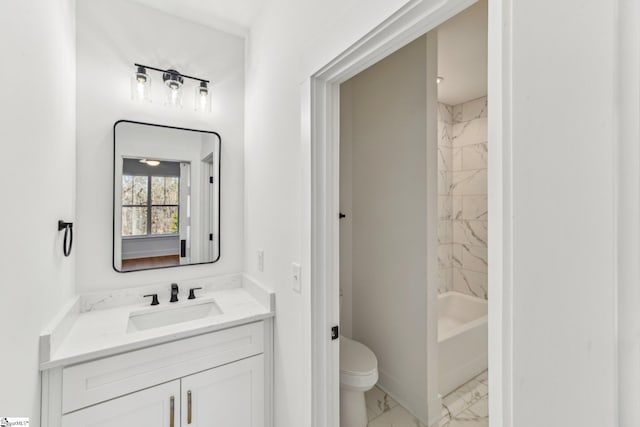 full bathroom with toilet, marble finish floor, bathing tub / shower combination, and vanity