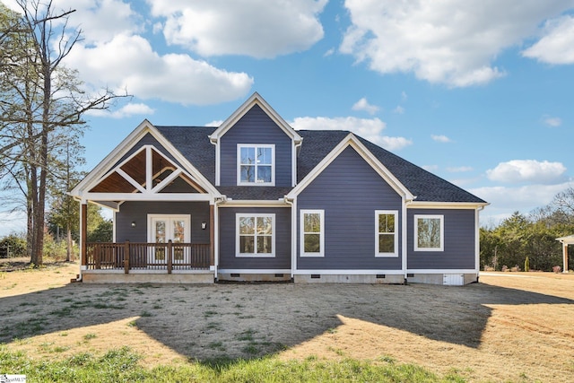 rear view of house featuring crawl space and french doors