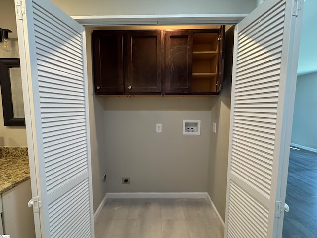 washroom featuring hookup for a washing machine, light wood-type flooring, hookup for an electric dryer, and baseboards