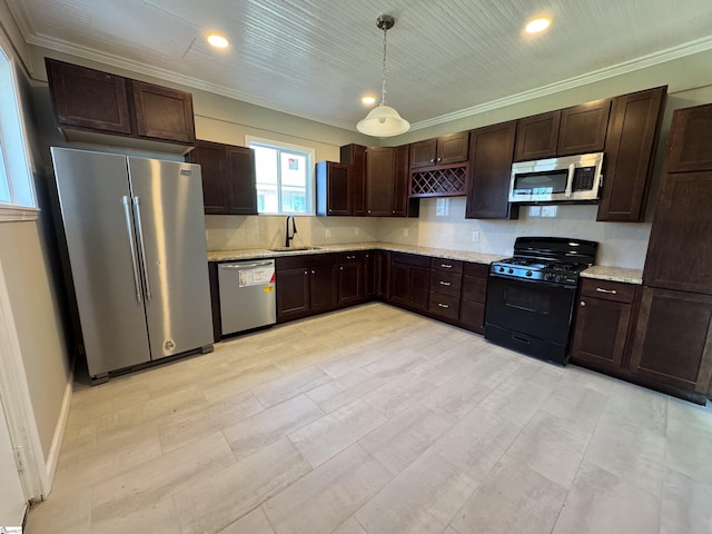 kitchen with appliances with stainless steel finishes, decorative light fixtures, crown molding, dark brown cabinets, and a sink