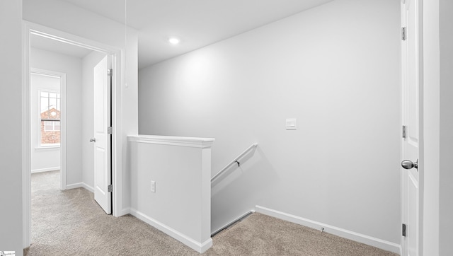 104 Sunriff Ct, Greer, SC 29651 - hallway with an upstairs landing and carpet floors