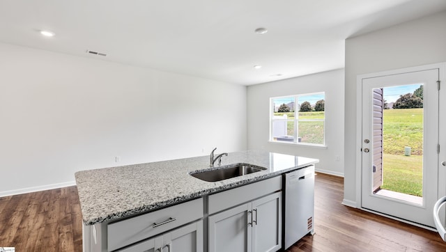 108 Sunriff Ct, Greer, SC 29651 - kitchen featuring stainless steel dishwasher, light stone counters, dark wood-style flooring, and recessed lighting