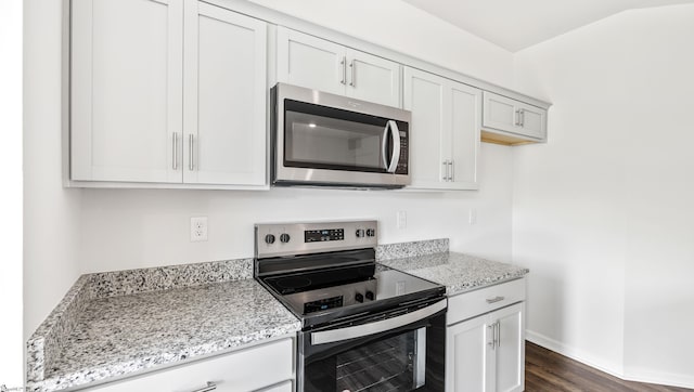 108 Sunriff Ct, Greer, SC 29651 - kitchen with appliances with stainless steel finishes, light stone countertops, dark wood-style flooring, and white cabinets