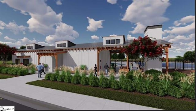 view of front facade with fence, a pergola, and board and batten siding