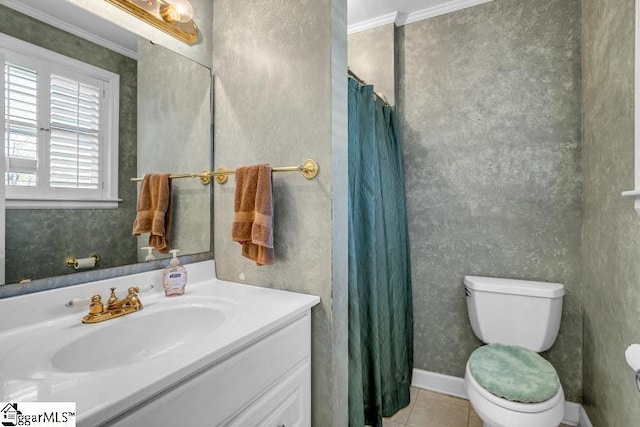 bathroom with toilet, vanity, ornamental molding, and tile patterned floors