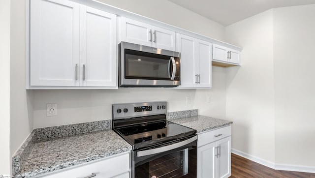 106 Sunriff Ct, Greer, SC 29651 - kitchen with stainless steel appliances, white cabinetry, light stone countertops, and dark wood-style flooring