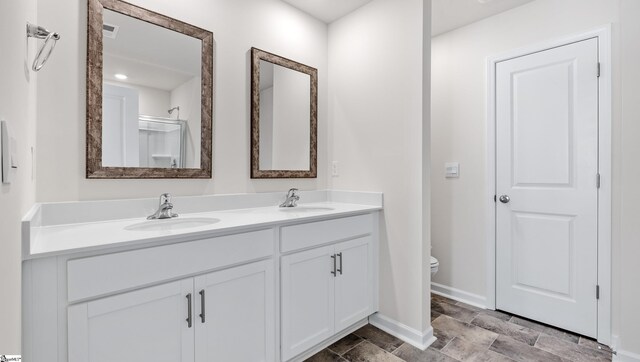 106 Sunriff Ct, Greer, SC 29651 - bathroom featuring double vanity and stone finish floors
