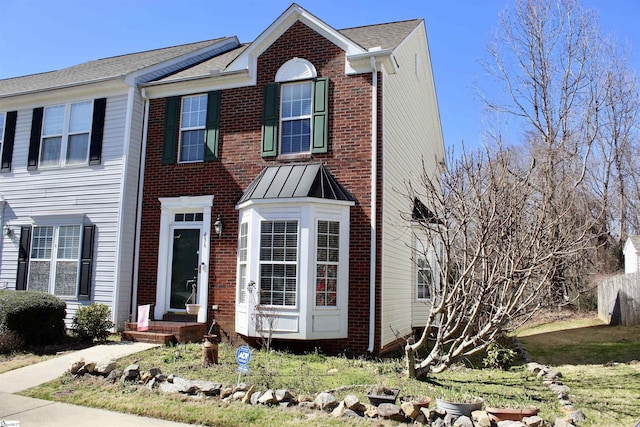 view of front of home featuring brick siding