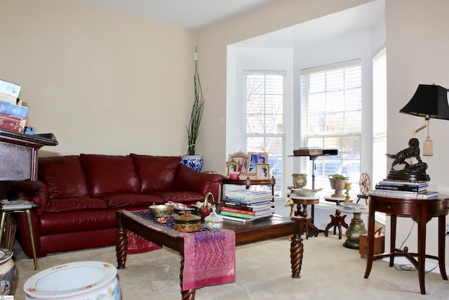 living area featuring light colored carpet