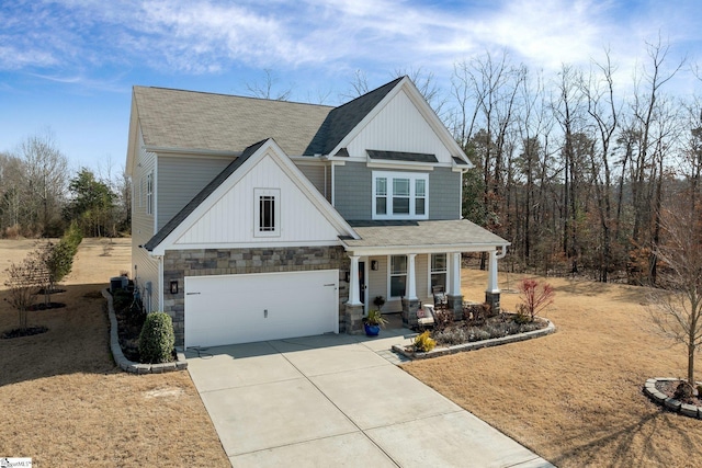 craftsman inspired home featuring roof with shingles, a porch, concrete driveway, an attached garage, and stone siding