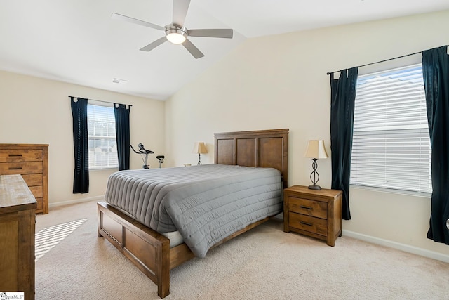 bedroom featuring light carpet, vaulted ceiling, visible vents, and baseboards