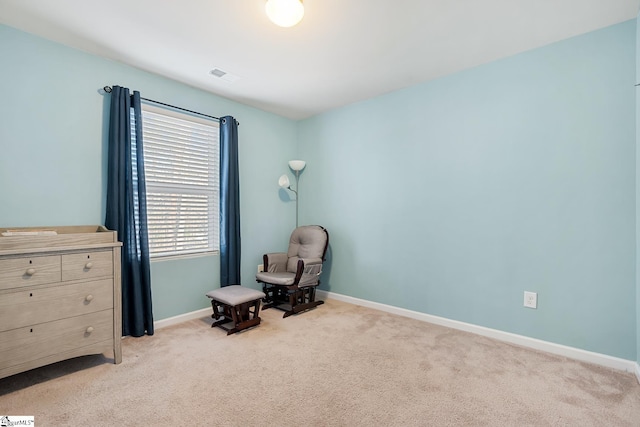 unfurnished room with light colored carpet, visible vents, and baseboards