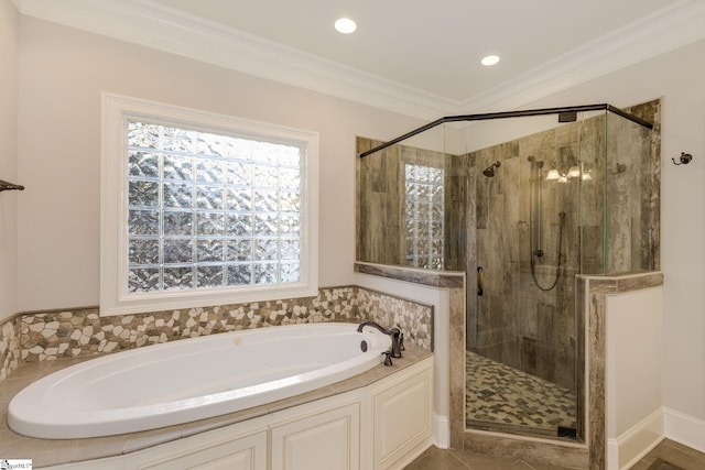 full bathroom featuring ornamental molding, recessed lighting, a shower stall, and a bath