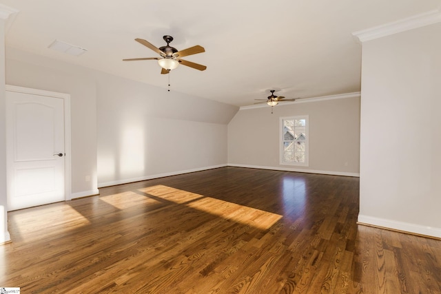 bonus room with vaulted ceiling, dark wood finished floors, a ceiling fan, and baseboards