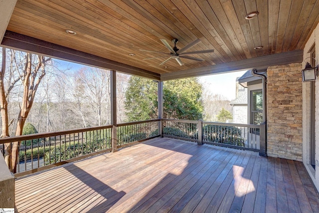 wooden terrace featuring ceiling fan