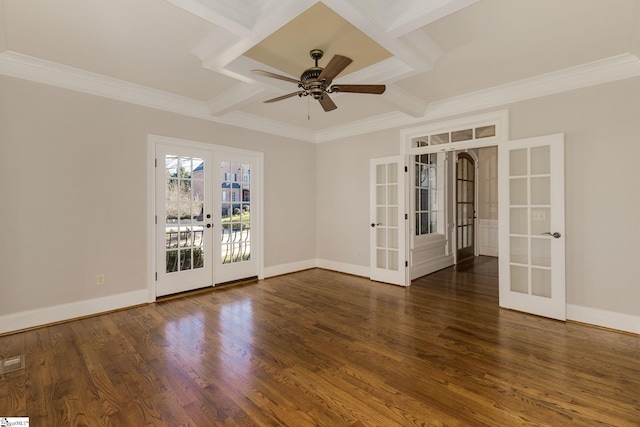 empty room with french doors, dark wood-type flooring, coffered ceiling, and baseboards