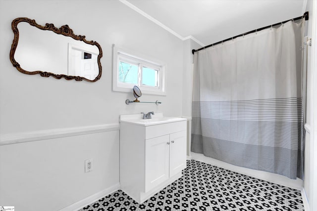 full bathroom with ornamental molding, vanity, and a shower with shower curtain