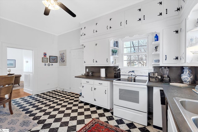 kitchen with light floors, white electric range oven, open shelves, dark countertops, and white cabinets