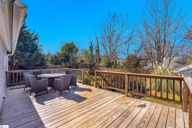 wooden deck featuring fence and outdoor dining space