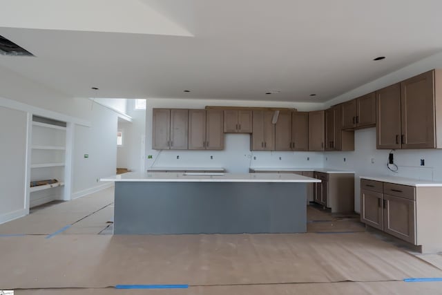 kitchen with light countertops and a kitchen island