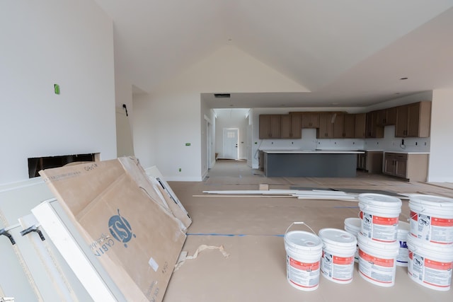 kitchen featuring vaulted ceiling and light countertops