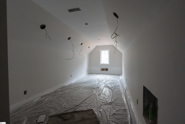 bonus room featuring vaulted ceiling