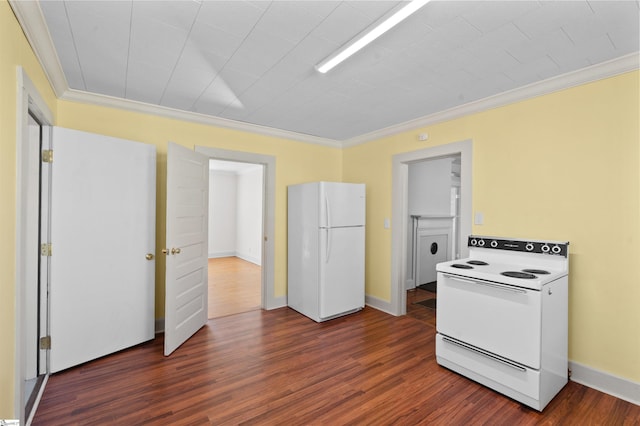 kitchen with ornamental molding, white appliances, dark wood finished floors, and baseboards