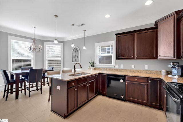 kitchen with visible vents, hanging light fixtures, a peninsula, black appliances, and a sink