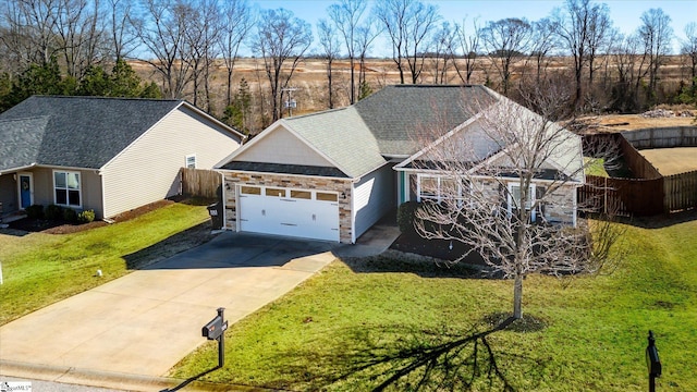 view of front facade featuring a garage, concrete driveway, stone siding, and a front yard