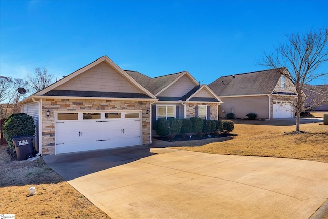 craftsman-style house with stone siding, driveway, and an attached garage