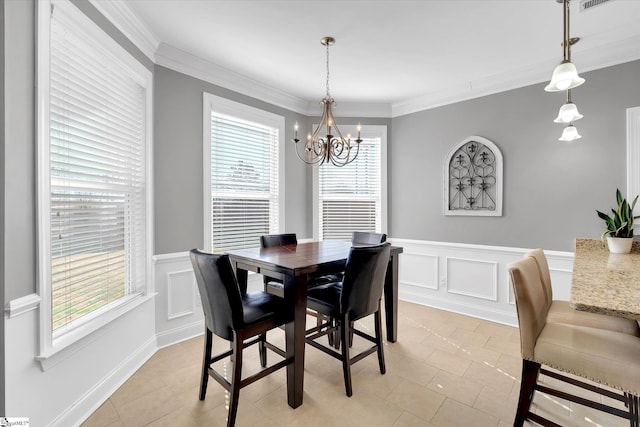 dining room with ornamental molding, a decorative wall, light tile patterned flooring, and a notable chandelier