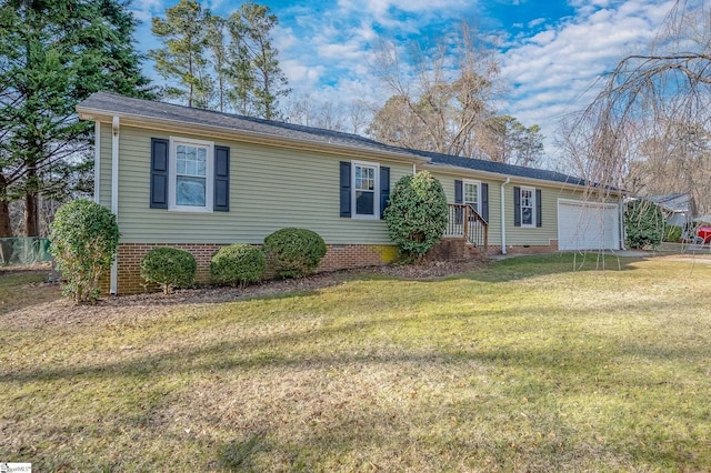 ranch-style home with a front lawn, crawl space, and an attached garage