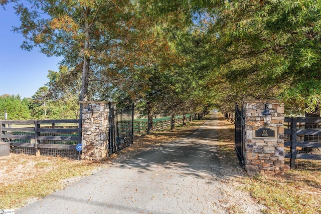 view of gate with fence