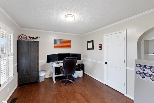 office area featuring visible vents, dark wood-type flooring, ornamental molding, and a wealth of natural light