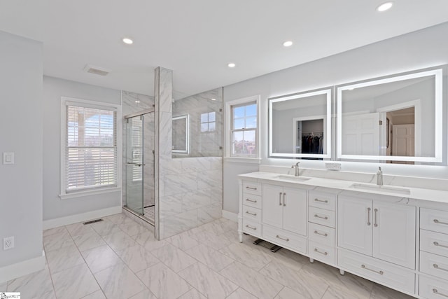 full bathroom featuring a shower stall, a sink, and recessed lighting